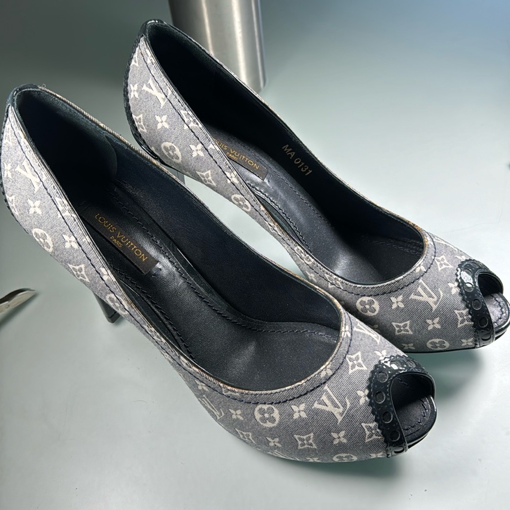Louis Vuitton Romance peep toe pumps.